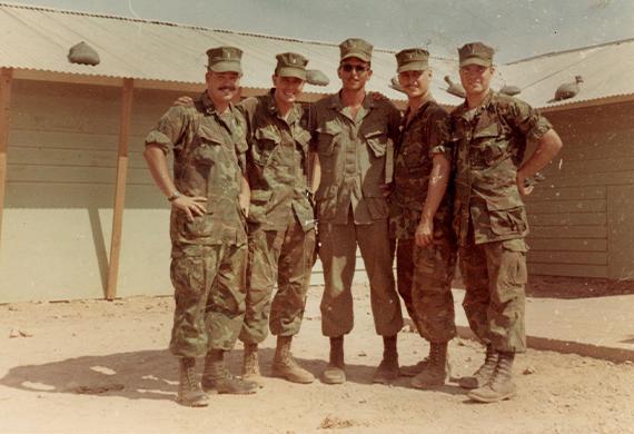 ​ Marist and the College is now preparing to pay tribute to him later this week at McCann Arena.  Kuffner, who roomed with his twin brother Dan during their sophomore year, graduated in May of '68. In September, Bill entered Officer Candidate School, embarking on a demanding 23-week training program to prepare him for the role of a Marine infantry platoon commander. By August 1969, he was stationed in South Vietnam, leading his own unit in the 7th Motor Transport Battalion, in support of the 3rd Marine Division's combat operations.  Marist Alumni Connect In Peace & War  Service was a defining characteristic of Marist's Class of 1968. Several graduates, including Kuffner, were deployed to South Vietnam. While there, by sheer coincidence, Kuffner and a few other recent Marist alumni were stationed in the same area simultaneously. This remarkable meeting took place in August 1969 when Kuffner and four fellow Marist officers were assigned to the vicinity near the Demilitarized Zone.   Marist alumni in Quang Tri, Vietnam, September 1969: From left, Bill Kuffner '68, Mike Santimauro '68, John Casserly '67, Brendan Burke '68, and Jim Barnes '68. Photo courtesy of Marist Archives.  ​